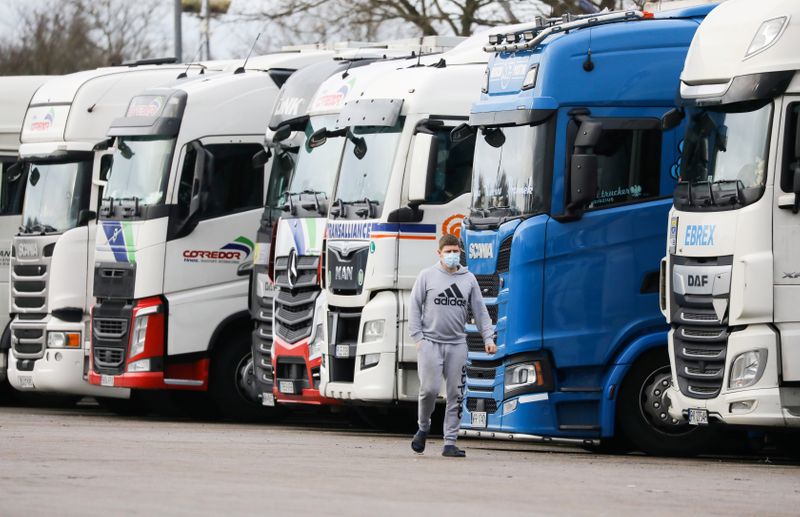 As queues form at gas stations, Britain vows to solve trucker shortage