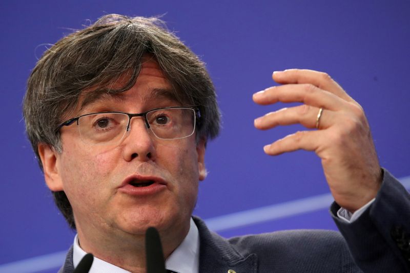 &copy; Reuters. FILE PHOTO: Catalan MEP Carles Puigdemont gestures during a joint news conference with Catalan MEPs Antoni Comin and Clara Ponsati regarding their immunity at the European Parliament, in Brussels, Belgium June 3, 2021. REUTERS/Yves Herman/File Photo