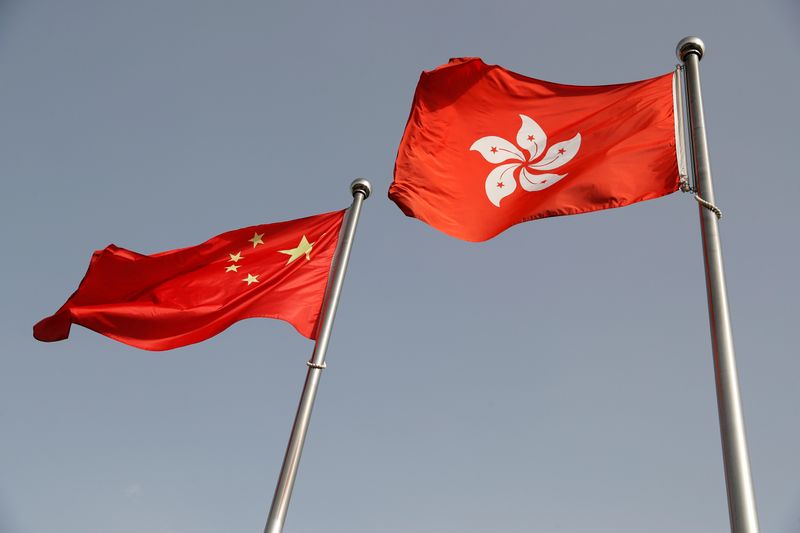 &copy; Reuters. FILE PHOTO: The Chinese and Hong Kong flags flutter at the office of the Government of the Hong Kong Special Administrative Region, ahead of a news conference held by Hong Kong Chief Executive Carrie Lam, in Beijing, China June 3, 2020. REUTERS/Carlos Gar