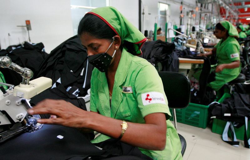 &copy; Reuters. FILE PHOTO: Garment workers sew pants in a Brandix factory, which exports many of the items to the European Union, in Colombo, in this file photo taken October 1, 2009. REUTERS/Andrew Caballero-Reynolds//File Photo