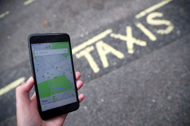 © Reuters. FILE PHOTO: The Uber application is seen on a mobile phone in London, Britain, September 14, 2018. REUTERS/Hannah McKay/File Photo