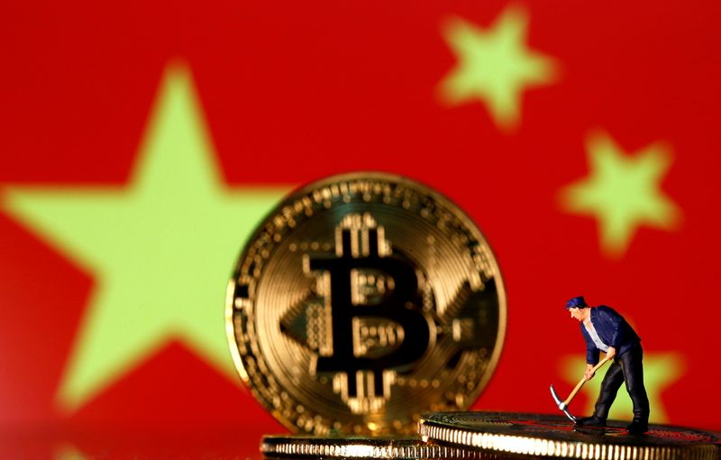 &copy; Reuters. FILE PHOTO: A small toy figurine is seen on representations of the Bitcoin virtual currency displayed in front of an image of China's flag in this illustration picture, April 9, 2019. REUTERS/Dado Ruvic/Illustration/File Photo