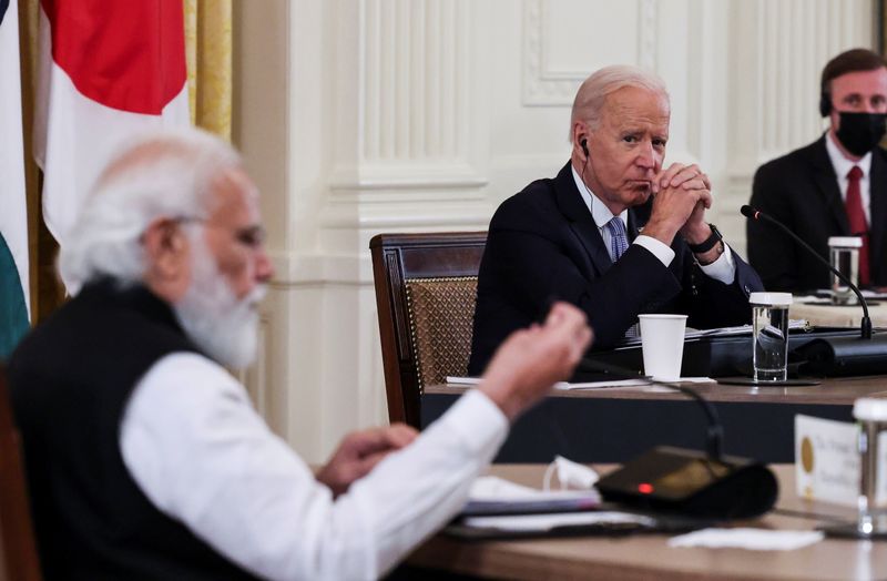 © Reuters. U.S. President Joe Biden listens as India's Prime Minister Narendra Modi speaks during a 'Quad nations' meeting at the Leaders' Summit of the Quadrilateral Framework held in the East Room at the White House in Washington, U.S., September 24, 2021. REUTERS/Evelyn Hockstein