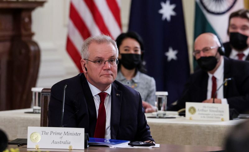 &copy; Reuters. FILE PHOTO: Australia's Prime Minister Scott Morrison is seated with members of his delegation as he participates in a 'Quad nations' meeting at the Leaders' Summit of the Quadrilateral Framework hosted by U.S. President Joe Biden in the East Room at the 