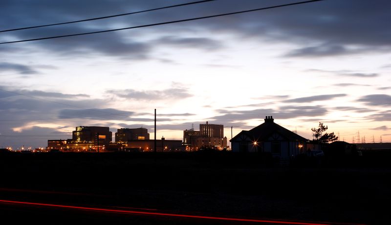 &copy; Reuters. FILE PHOTO: Car lights stream past a home near Dungeness nuclear power station in Kent, southern England, December 4, 2012./File Photo