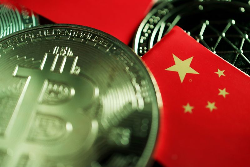 &copy; Reuters. FILE PHOTO: A Chinese flag is seen among representations of Bitcoin and other cryptocurrencies in this illustration picture taken June 2, 2021. REUTERS/Florence Lo/Illustration/File Photo