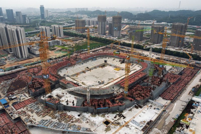 &copy; Reuters. FILE PHOTO: An aerial view shows the construction site of Guangzhou Evergrande Soccer Stadium, a new stadium for Guangzhou FC, developed by China Evergrande Group, in Guangzhou, Guangdong province, China September 26, 2021. REUTERS/Thomas Suen