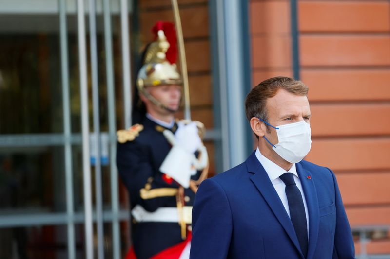 &copy; Reuters. French President Emmanuel Macron looks on before greeting WHO Director-General Tedros Adhanom Ghebreyesus as they arrive to chair a ceremony for the opening of the World Health Organisation Academy in Lyon, France, September 27, 2021. REUTERS/Denis Balibo
