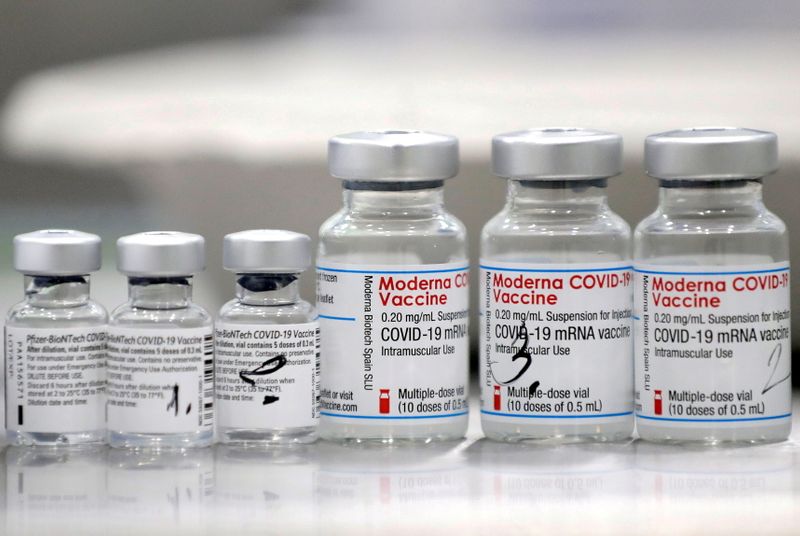 &copy; Reuters. FILE PHOTO: Vials of coronavirus disease (COVID-19) vaccines of Pfizer-BioNTech and Moderna are seen in the town of Ricany near Prague, Czech Republic, February 25, 2021.  REUTERS/David W Cerny