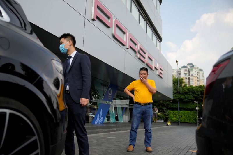 Unpaid by Evergrande, supplier sells Porsche and home to rescue his business