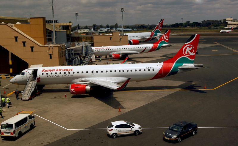 &copy; Reuters. FILE PHOTO: Kenya Airways planes are seen through a window as the Jomo Kenyatta international airport reopens after flights were suspended following the coronavirus disease (COVID-19) outbreak in Nairobi, Kenya August 1, 2020. REUTERS/Njeri Mwangi/File Ph