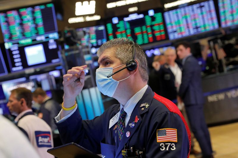 &copy; Reuters. FILE PHOTO: A trader works on the trading floor at the New York Stock Exchange (NYSE) in Manhattan, New York City, U.S., August 10, 2021. REUTERS/Andrew Kelly