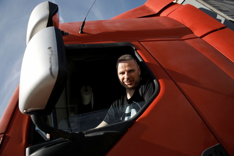 © Reuters. Truck driver Jakub Pajka, 35, poses for a picture after an interview with Reuters at the highway A2 parking near Warsaw, Poland, September 28, 2021. REUTERS/Kacper Pempel