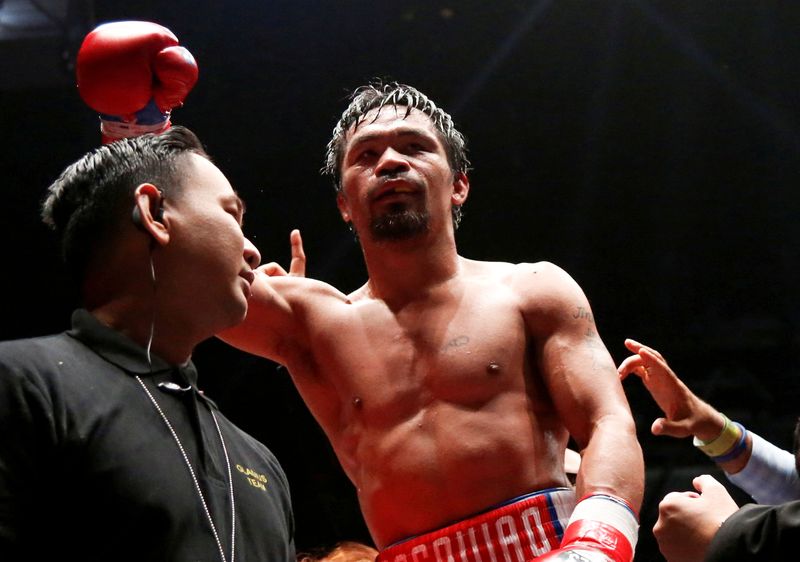 &copy; Reuters. FILE PHOTO: Boxing - WBA Welterweight Title Fight - Manny Pacquiao v Lucas Matthysse - Axiata Arena, Kuala Lumpur, Malaysia - July 15, 2018   Manny Pacquiao celebrates after winning the bout against Lucas Matthysse. Picture taken July 15, 2018.   REUTERS/