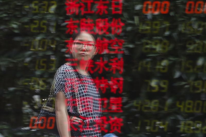 &copy; Reuters. A woman is reflected on an electronic board showing stock information at a brokerage house in Shanghai, China, July 3, 2015. China stocks slumped again on Friday, taking their three-week tumble to nearly 30 percent and wiping out most of this year's gains