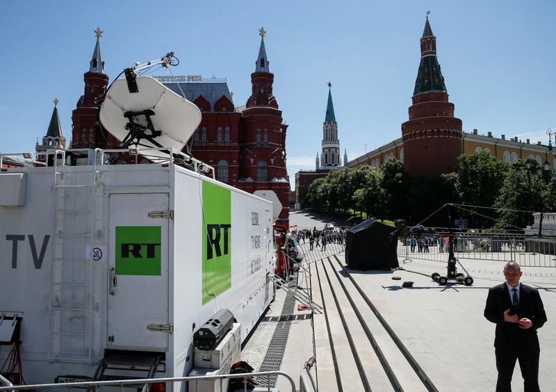 &copy; Reuters. Vehicles of Russian state-controlled broadcaster Russia Today (RT) are seen near the Red Square in central Moscow, Russia June 15, 2018. Picture taken June 15, 2018.  REUTERS/Gleb Garanich