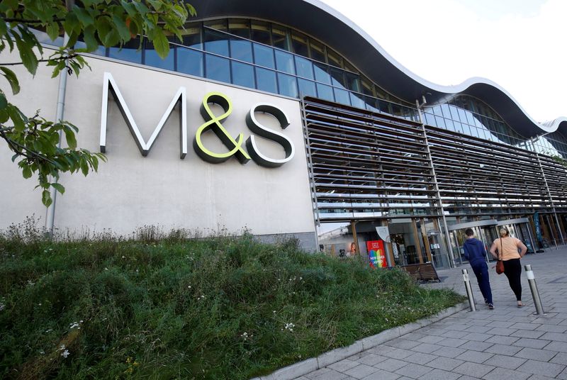 &copy; Reuters. FILE PHOTO: People walk outside a Marks and Spencer (M&S) store amid the outbreak of the coronavirus disease (COVID-19), in Cheshire, Britain  August 18, 2020. REUTERS/Jason Cairnduff