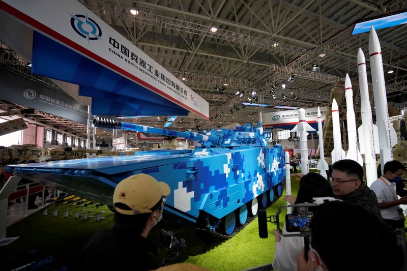 &copy; Reuters. People look at a display of VN16 amphibious armoured assault vehicle at the China International Aviation and Aerospace Exhibition, or Airshow China, in Zhuhai, Guangdong province, China September 29, 2021. REUTERS/Aly Song