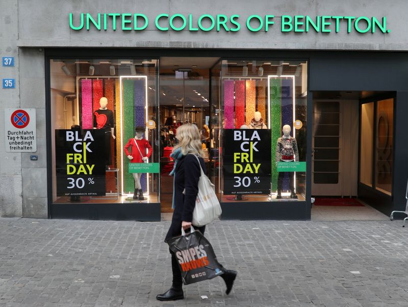 &copy; Reuters. FILE PHOTO: Posters offering special discount on Black Friday sales are seen in front of a United Colors of Benetton kid's fashion store, as the spread of the coronavirus disease (COVID-19) continues, in Zurich, Switzerland November 27, 2020.  REUTERS/Arn