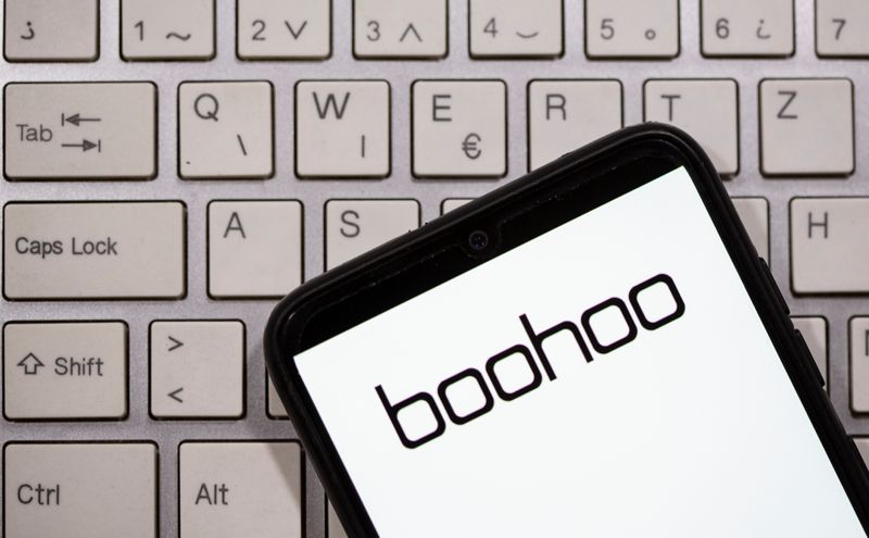&copy; Reuters. A smartphone with the Boohoo logo displayed is seen on a keyboard in this illustration taken September 30, 2020. REUTERS/Dado Ruvic/Illustration