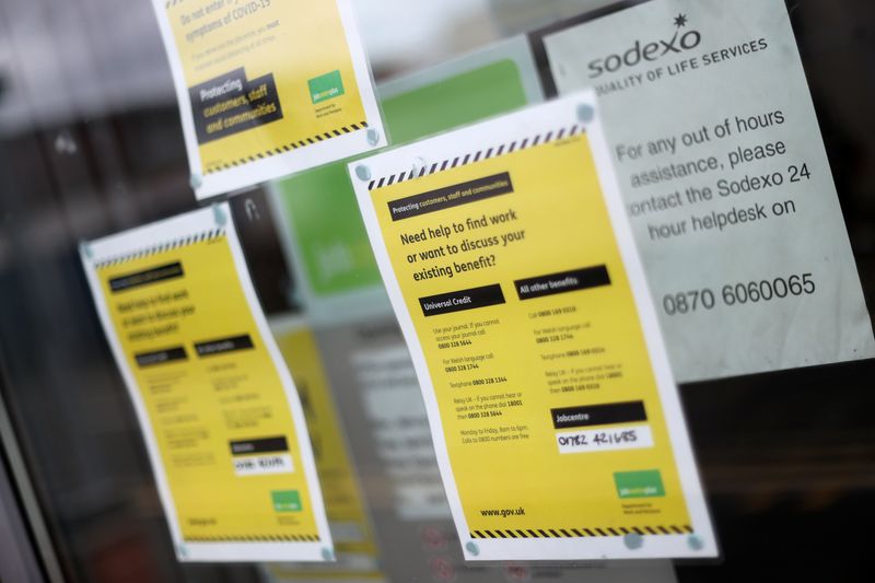 &copy; Reuters. FILE PHOTO: Advertisements for jobs are seen in a Job Recruitment Centre's window, amid the coronavirus disease (COVID-19) outbreak, in Stoke-on-Trent, Staffordshire, Britain August 6, 2020. REUTERS/Carl Recine