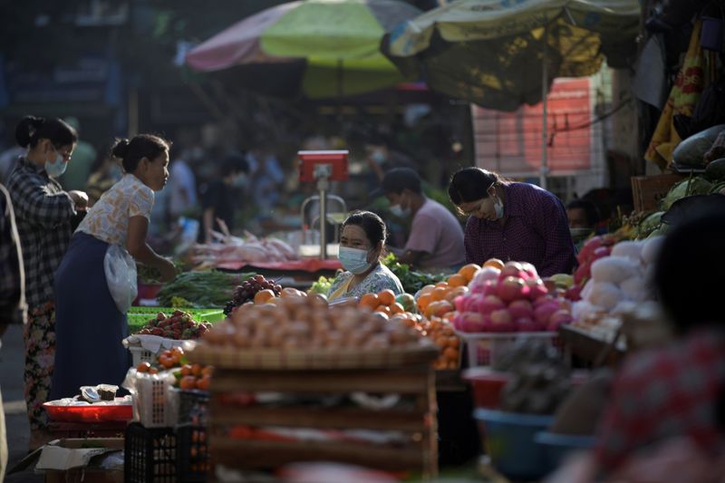 &copy; Reuters. FILE PHOTO: People are seen at a market after army seized power in a coup in Yangon, Myanmar February 2, 2021. REUTERS/Stringer