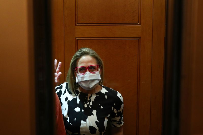 &copy; Reuters. FILE PHOTO: Senator Kyrsten Sinema (D-AZ) enters an elevator before walking onto the Senate Floor on Capitol Hill in Washington, U.S., September 29, 2021. REUTERS/Tom Brenner
