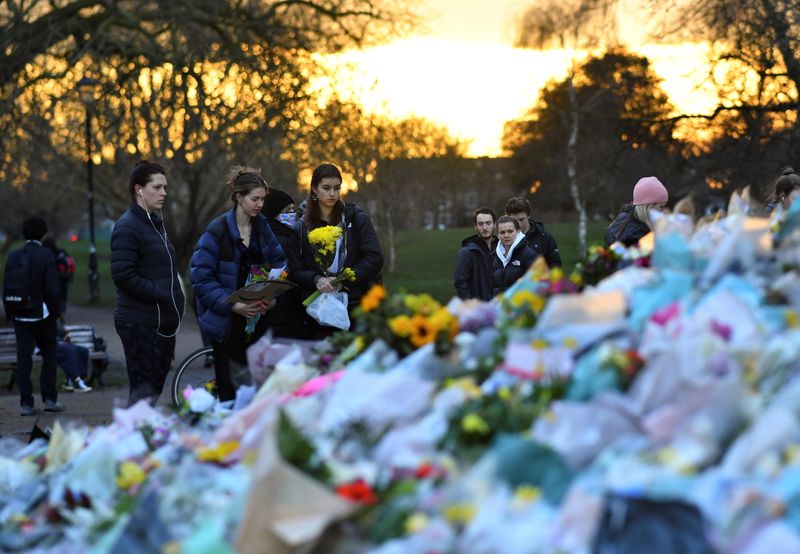 &copy; Reuters. People put flowers at the memorial site at the Clapham Common Bandstand, following the kidnap and murder of Sarah Everard, in London, Britain, March 17, 2021. REUTERS/Dylan Martinez