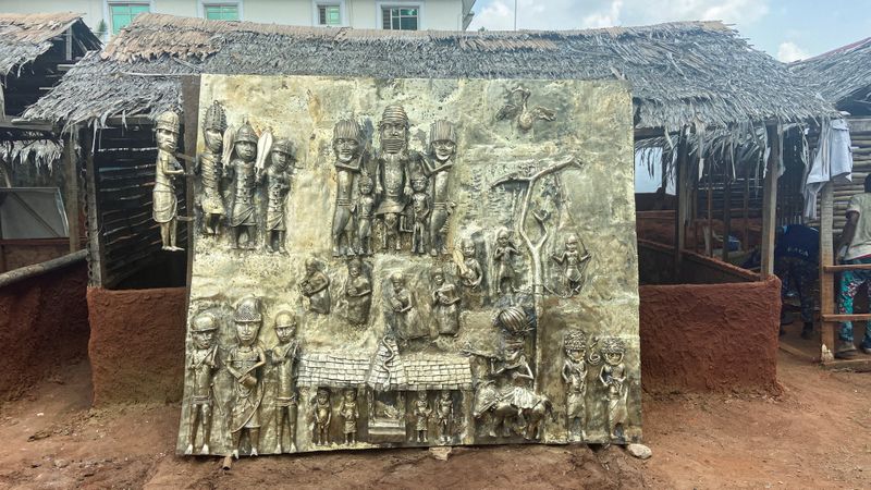 &copy; Reuters. FILE PHOTO: A newly made bronze plaque depicting historical events in West Africa's once mighty Kingdom of Benin, which is being offered as a gift to the British Museum, is seen on display in Benin City, Nigeria, July 31, 2021.   REUTERS/Tife Owolabi/File
