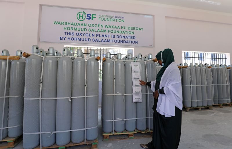 &copy; Reuters. General Director of Banadir Hospital, Fartun Sharif inspects the medical oxygen cylinder tanks at the public oxygen plant, amid the coronavirus disease (COVID-19) pandemic, at the Banadir Hospital in Mogadishu, Somalia September 28, 2021. REUTERS/Feisal O
