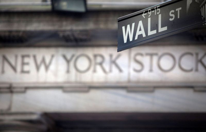 &copy; Reuters. FILE PHOTO: A Wall Street sign is pictured outside the New York Stock Exchange in New York, October 28, 2013.  REUTERS/Carlo Allegri