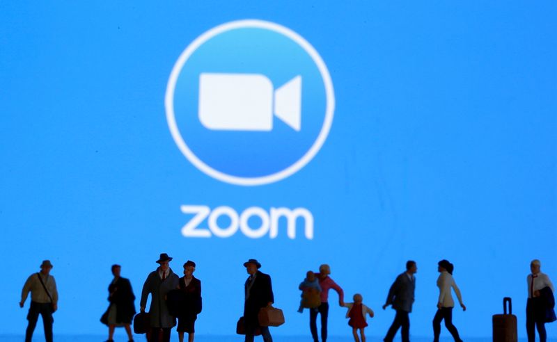 &copy; Reuters. FILE PHOTO: Small toy figures are seen in front of diplayed Zoom logo in this illustration taken March 19, 2020. REUTERS/Dado Ruvic/Illustration