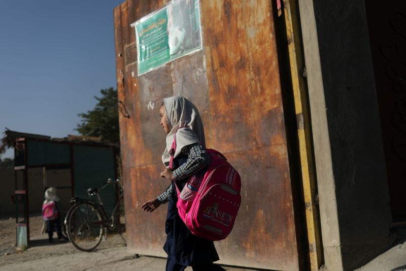 &copy; Reuters. An Afghan girl goes to a school in Kabul, Afghanistan, September 18, 2021. WANA (West Asia News Agency) via REUTERS ATTENTION EDITORS - THIS PICTURE WAS PROVIDED BY A THIRD PARTY.