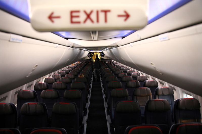 &copy; Reuters. FILE PHOTO: Rows of empty seats of an American Airline flight are seen, as coronavirus disease (COVID-19) disruption continues across the global industry, during a flight between Washington D.C. and Miami, in Washington, U.S., March 18, 2020. REUTERS/Carl