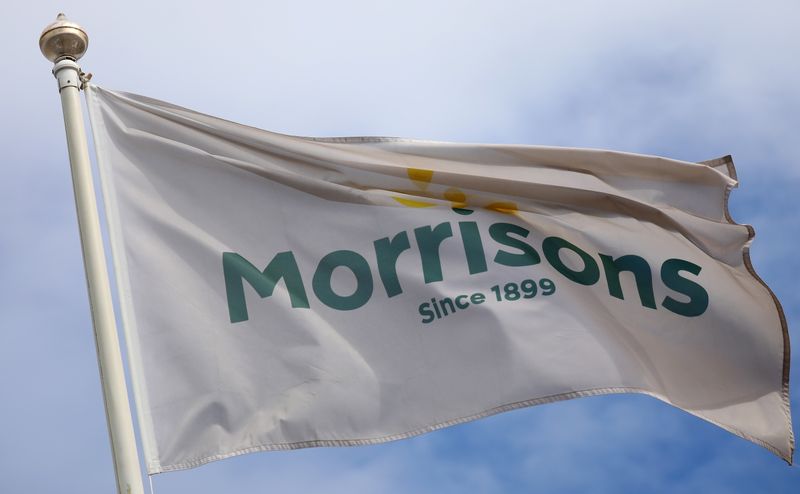 &copy; Reuters. FILE PHOTO: A flag flies outside a Morrisons supermarket in New Brighton, Britain, July 5, 2021. REUTERS/Phil Noble/File Photo