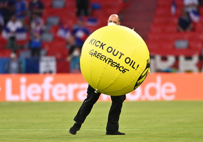 &copy; Reuters. FILE PHOTO: Soccer Football - Euro 2020 - Group F - France v Germany - Football Arena Munich, Munich, Germany - June 15, 2021 A Greenpeace protestor on the pitch before the match Pool via REUTERS/Lukas Barth-Tuttas
