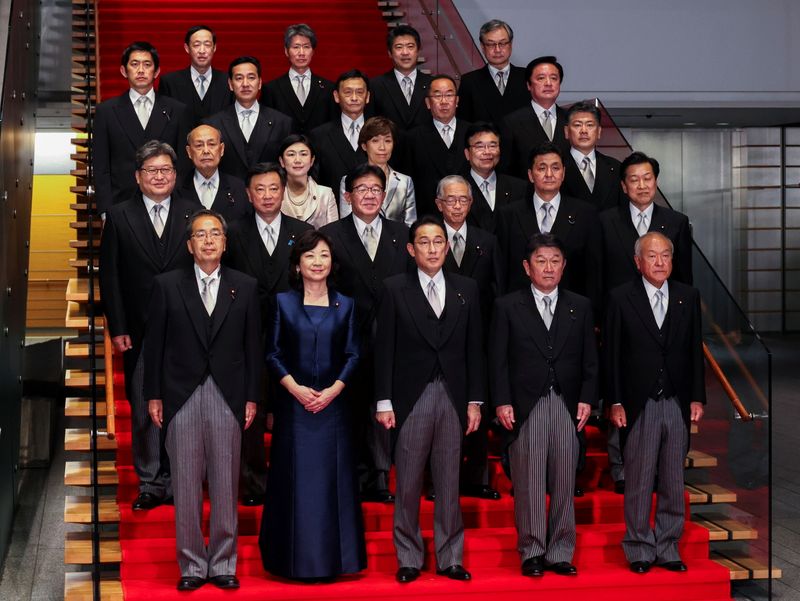 © Reuters. Newly elected Prime Minister Fumio Kishida poses with his cabinet members for a photo session at the prime minister's official residence in Tokyo, Japan October 4, 2021. Yoshikazu Tsuno/Pool via REUTERS