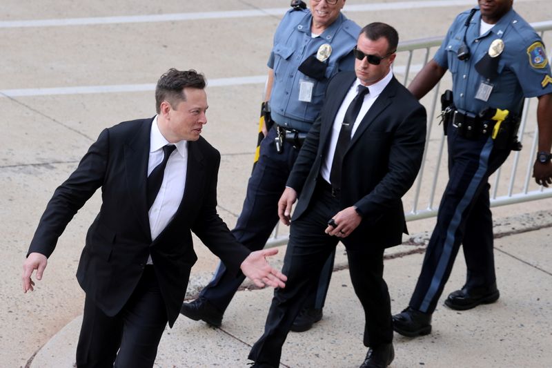 &copy; Reuters. FILE PHOTO: Tesla CEO Elon Musk reacts to onlookers as he departs after taking the stand to defend Tesla Inc's 2016 deal for SolarCity in a case before the Delaware Court of Chancery in Wilmington, Delaware, U.S. July 12, 2021. REUTERS/Jonathan Ernst 