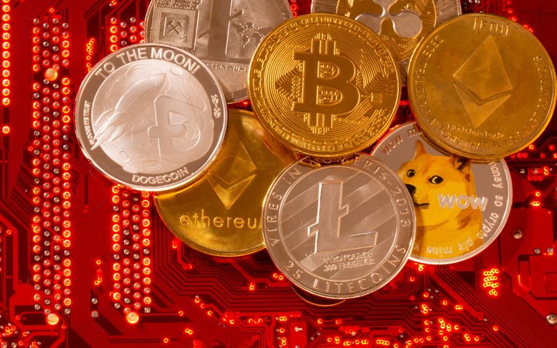 &copy; Reuters. Representations of cryptocurrencies Bitcoin, Ethereum, DogeCoin, Ripple, Litecoin are placed on PC motherboard in this illustration taken, June 29, 2021. REUTERS/Dado Ruvic/Illustration