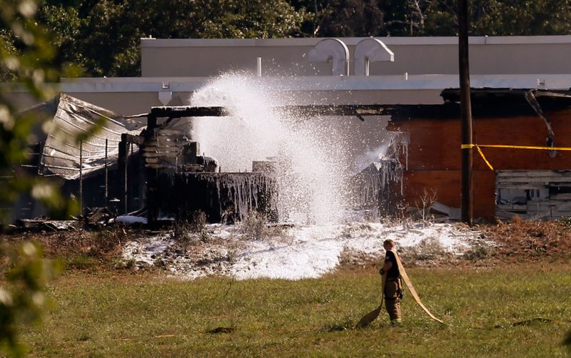 &copy; Reuters. FILE PHOTO: Firefighters spray foam on the smoking wreckage of a U.S. Department of Agriculture facility, closed last week due to threats, which burned down at the USDA complex outside of Washington in Beltsville, Maryland, U.S., September 6, 2016.  REUTE