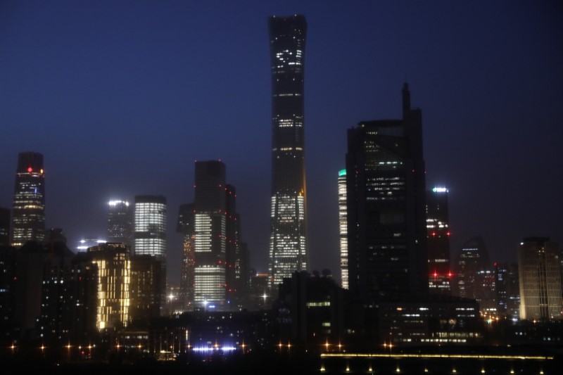 &copy; Reuters. FILE PHOTO: Buildings in the Central Business District (CBD) are seen lit up during the night in Beijing, China April 15, 2021. Picture taken April 15, 2021. REUTERS/Tingshu Wang