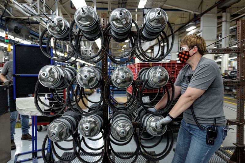 &copy; Reuters. FILE PHOTO: A person works on a Polaris ATV assembly line at its manufacturing and assembly plant in Roseau, Minnesota, U.S. June 7, 2021. REUTERS/Dan Koeck