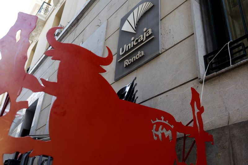 &copy; Reuters. FILE PHOTO: The logo of Unicaja bank is seen on the facade of a Unicaja bank branch in Ronda, southern Spain, September 7, 2021. REUTERS/Jon Nazca/File Photo