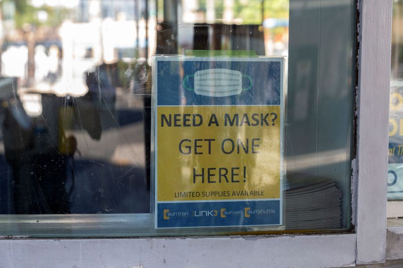 &copy; Reuters. FILE PHOTO: A sign advertises free masks to prevent the spread of the coronavirus disease (COVID-19), at the downtown bus station in Tucson, Arizona, U.S., June 20, 2020. REUTERS/Cheney Orr