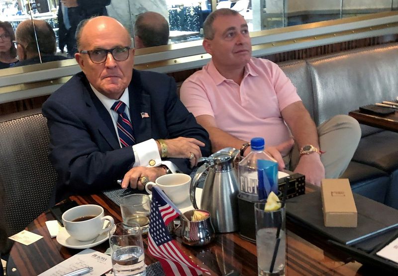 © Reuters. FILE PHOTO: U.S. President Trump's former lawyer Rudy Giuliani has coffee with Ukrainian-American businessman Lev Parnas at the Trump International Hotel in Washington, U.S., September 20, 2019.  REUTERS/Aram Roston/File Photo/File Photo