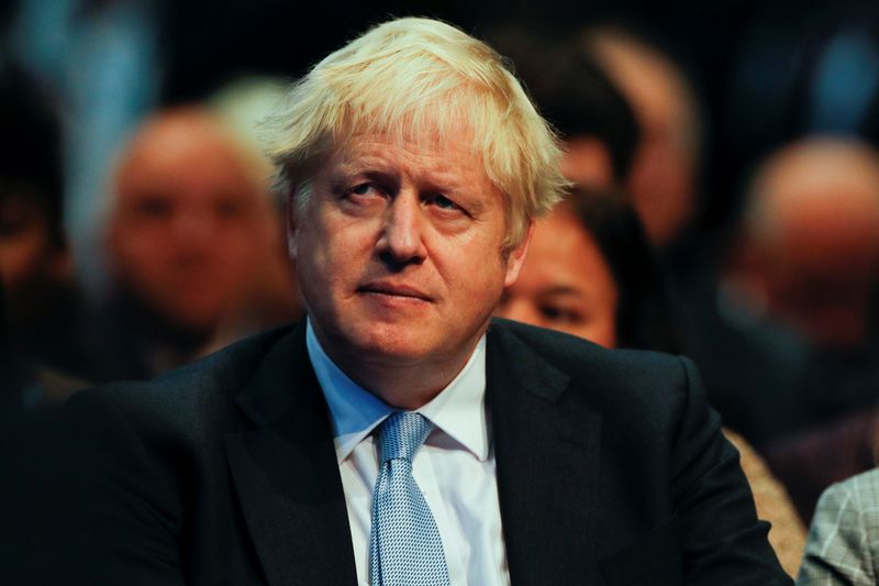 &copy; Reuters. FILE PHOTO: Britain's Prime Minister Boris Johnson looks on as he attends the annual Conservative Party conference, in Manchester, Britain, October 4, 2021. REUTERS/Phil Noble