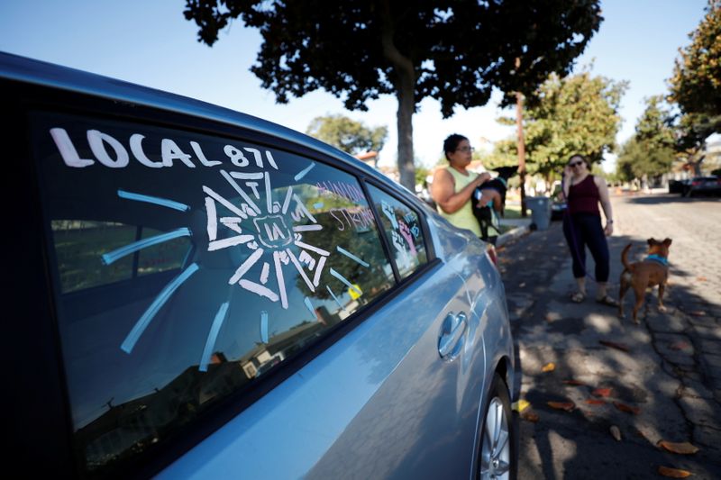 &copy; Reuters. The adorned windows of the car belonging to script coordinator Amy Thurlow, a member of the International Alliance of Theatrical Stage Employees (IATSE) Local 871 since 2018, are pictured the day after 90% of its members cast ballots and more than 98% of 