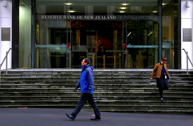 New Zealand ends ultra-low interest rates, signals more hikes