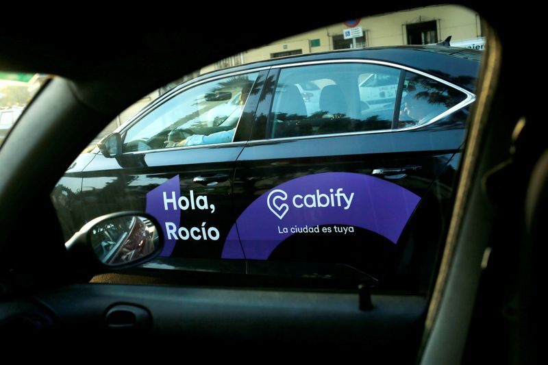 &copy; Reuters. FILE PHOTO: A Cabify taxi car is seen through the window of a car in Malaga, southern Spain August 3, 2018. REUTERS/Jon Nazca
