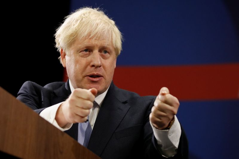&copy; Reuters. Britain's Prime Minister Boris Johnson gestures as he delivers a speech during the annual Conservative Party Conference, in Manchester, Britain, October 6, 2021. REUTERS/Phil Noble